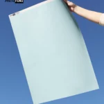 Fond vinyle bleu doux, surface unie et sans reflets