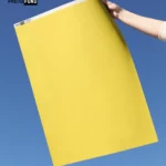 Fond vinyle jaune vif "ليموناضة", idéal pour des photos vibrantes et joyeuses en studio.